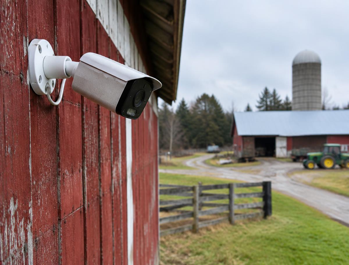 Security camera mounted on a red barn
